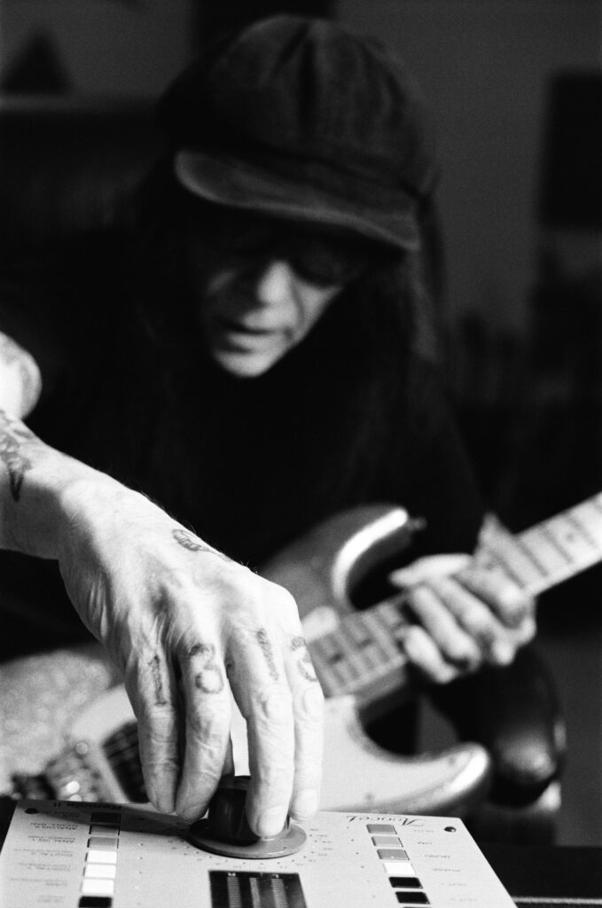 mick mars with guitar